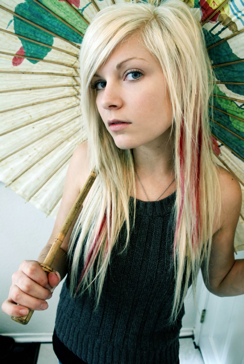 Side profile of a woman showing a textured emo hairstyle softly framing her jawline generated by blondefilter.net