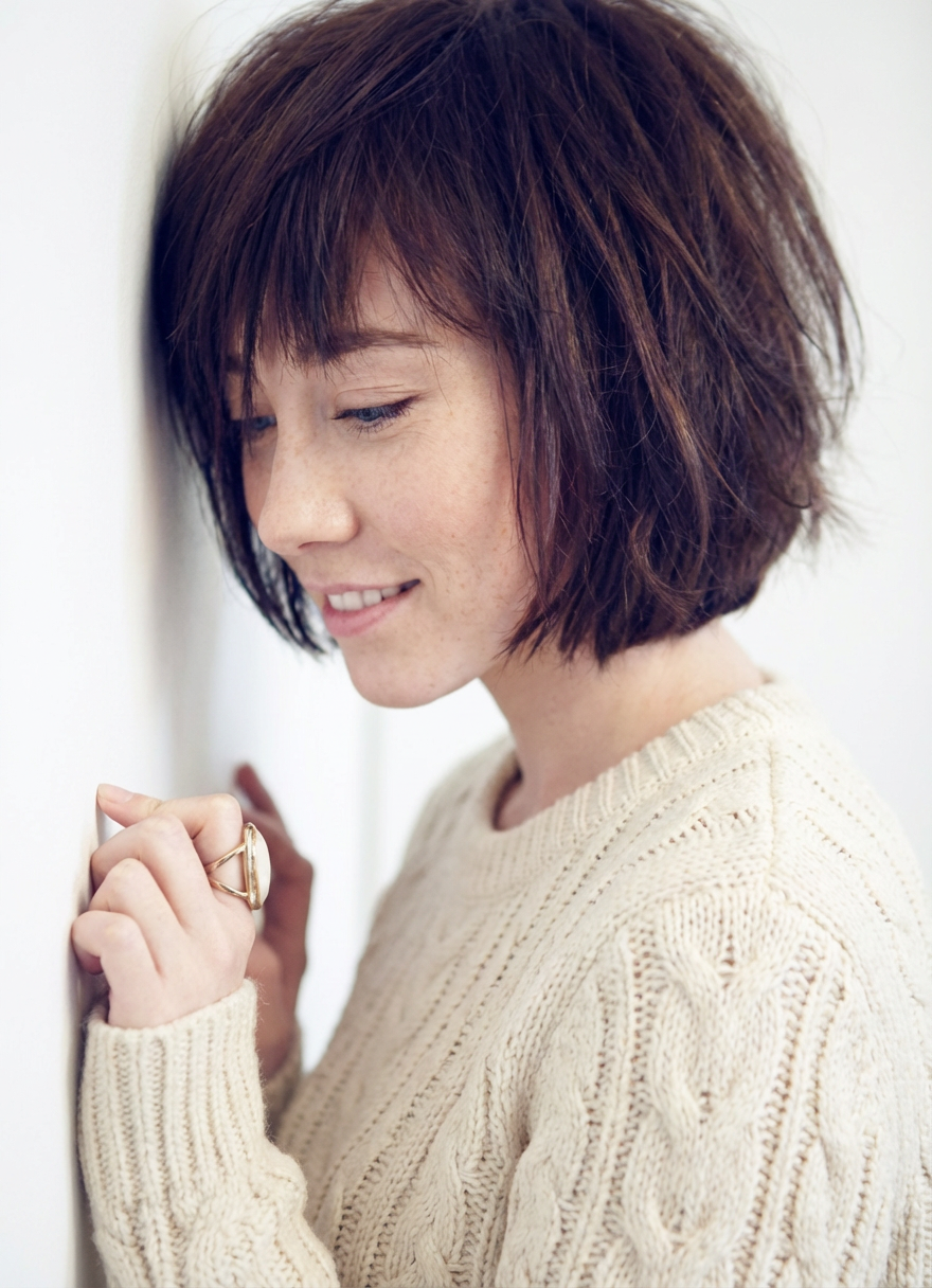 Soft side profile of woman wearing tousled textured Japanese short bob with piecey bangs, generated by blondefilter.net