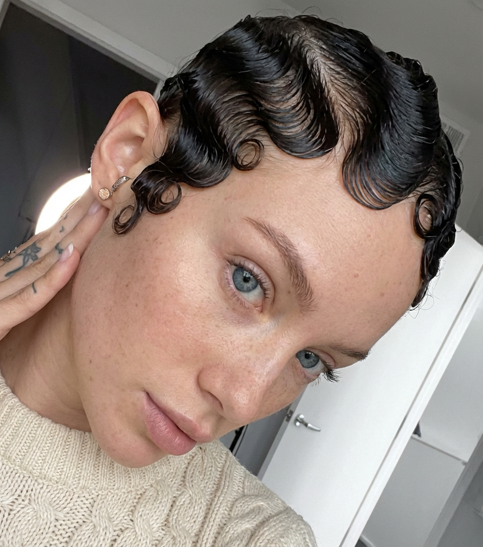 Close-up of modern woman showing glossy sculpted Marcel waves styled close to the scalp, generated by blondefilter.net