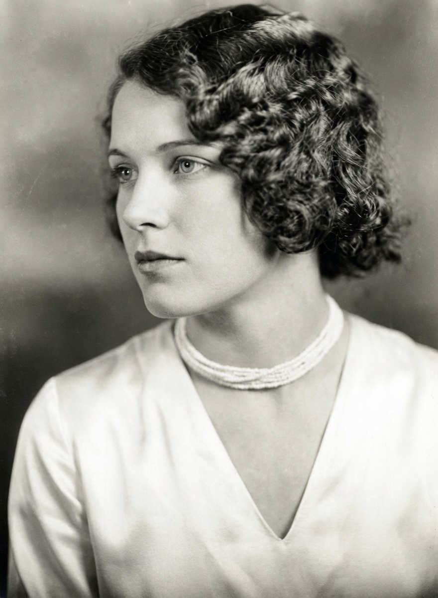 Three-quarter view of woman with softly defined Marcel waves through a chin-length curly bob, generated by blondefilter.net