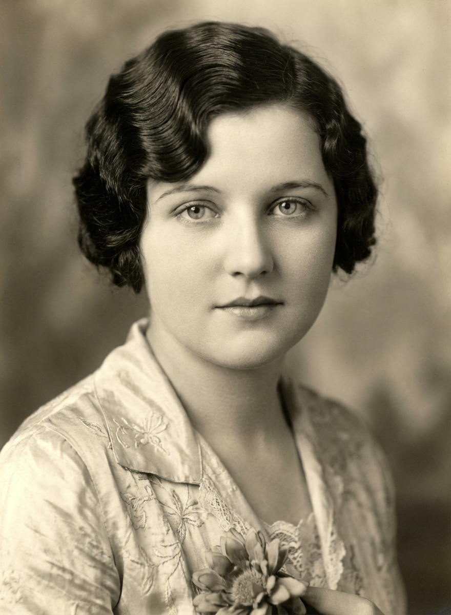 Vintage studio portrait of woman with short Marcel waves bob and soft 1920s-inspired styling, generated by blondefilter.net