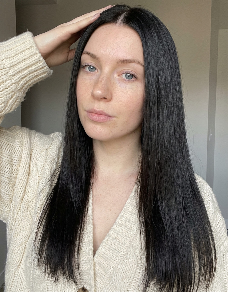 Indoor portrait of woman with long straight hair and sharp middle part generated by blondefilter.net